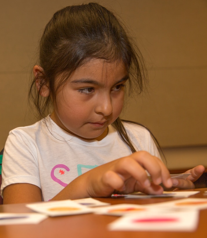 Mia Perry, a retreat participant and third-grade student, picks her “super powers” in a self-esteem class during a Smart-Girl retreat aboard Marine Corps Air Station Miramar, Calif., Aug. 16. Smart-Girl is an affiliate of the Boys & Girls Clubs of America and is designed to engage girls in activities that develop social and emotional skills.