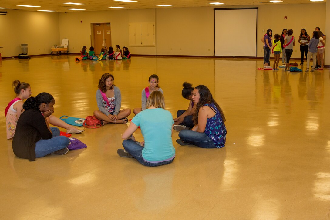 Girls play introduction games with peers during a Smart-Girl retreat aboard Marine Corps Air Station Miramar, Calif., Aug. 16. The Smart-Girl program helps girls learn skills in communication, leadership, critical thinking, assertiveness and refusal, anti-bullying, healthy decision making and smart social media usage. 
