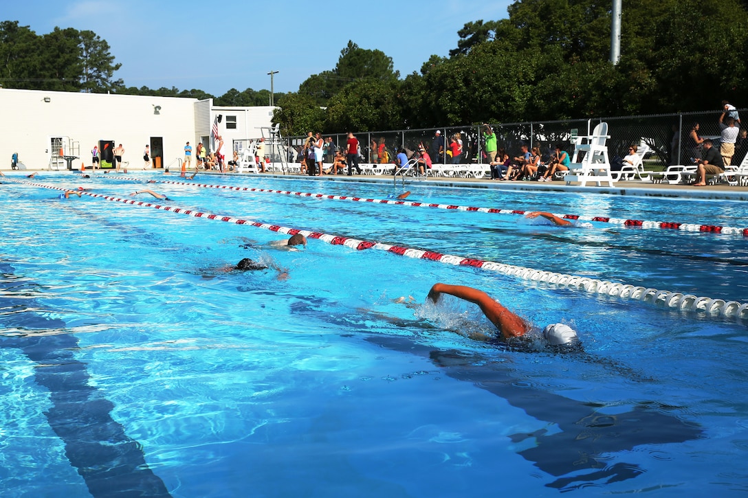 Competitors use their fastest strokes to complete the first event of Marine Corps Community Services' Sprint Triathlon/Relay at Marine Corps Air Station Cherry Point, N.C., Aug. 16, 2014. The different events of the triathlon included a 400-meter swim, 10-mile bike ride and three-mile run as part of Semper Fit's Grand Prix 2014 series.