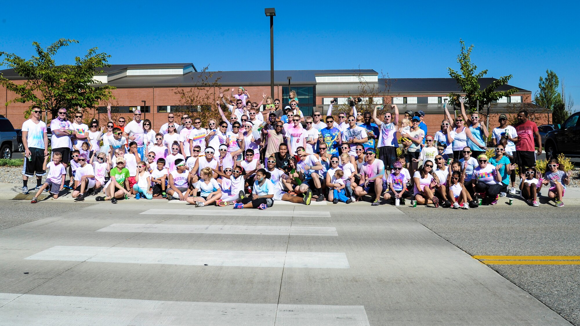 Team Fairchild Airmen and families participate in a Color Run 5k at Fairchild Air Force Base, Washington, Aug. 16, 2014. The Color Run was meant to increase base awareness for the upcoming Air Force Ball being held at the Red Lion at the Park in Spokane, Washington, on Sept. 6, celebrating the Air Force’s 67th birthday. (U.S. Air Force photo by Airman 1st Class Janelle Patiño/Released)
