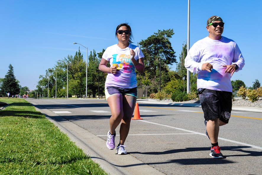 Team Fairchild Airmen and families participate in a Color Run 5k at Fairchild Air Force Base, Washington, Aug. 16, 2014. The Color Run was meant to increase base awareness for the upcoming Air Force Ball being held at the Red Lion at the Park in Spokane, Washington, on Sept. 6, celebrating the Air Force’s 67th birthday. (U.S. Air Force photo by Airman 1st Class Janelle Patiño/Released)