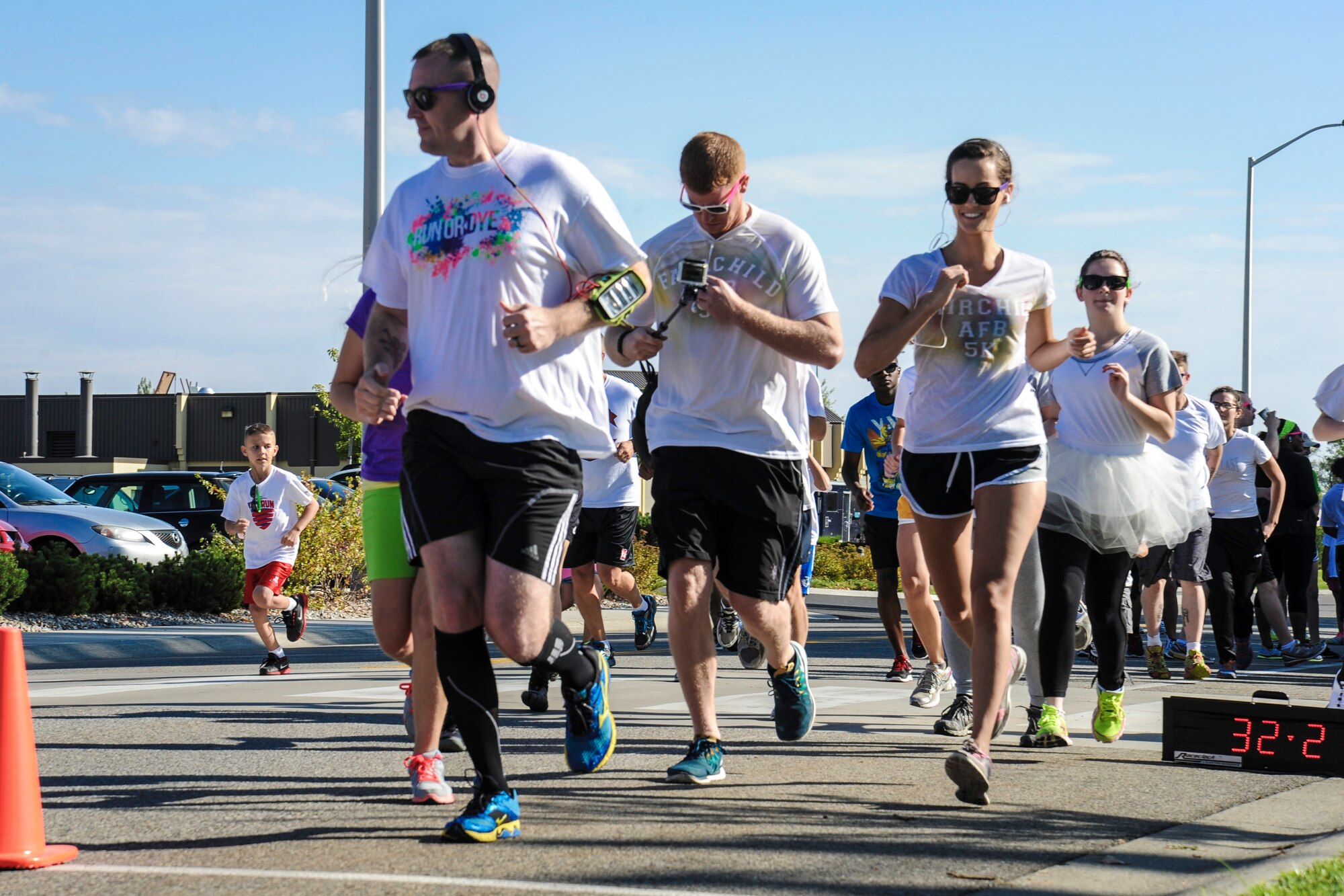 Team Fairchild Airmen and families participate in a Color Run 5k at Fairchild Air Force Base, Washington, Aug. 16, 2014. The Color Run was meant to increase base awareness for the upcoming Air Force Ball being held at the Red Lion at the Park in Spokane, Washington, on Sept. 6, celebrating the Air Force’s 67th birthday. (U.S. Air Force photo by Airman 1st Class Janelle Patiño/Released)