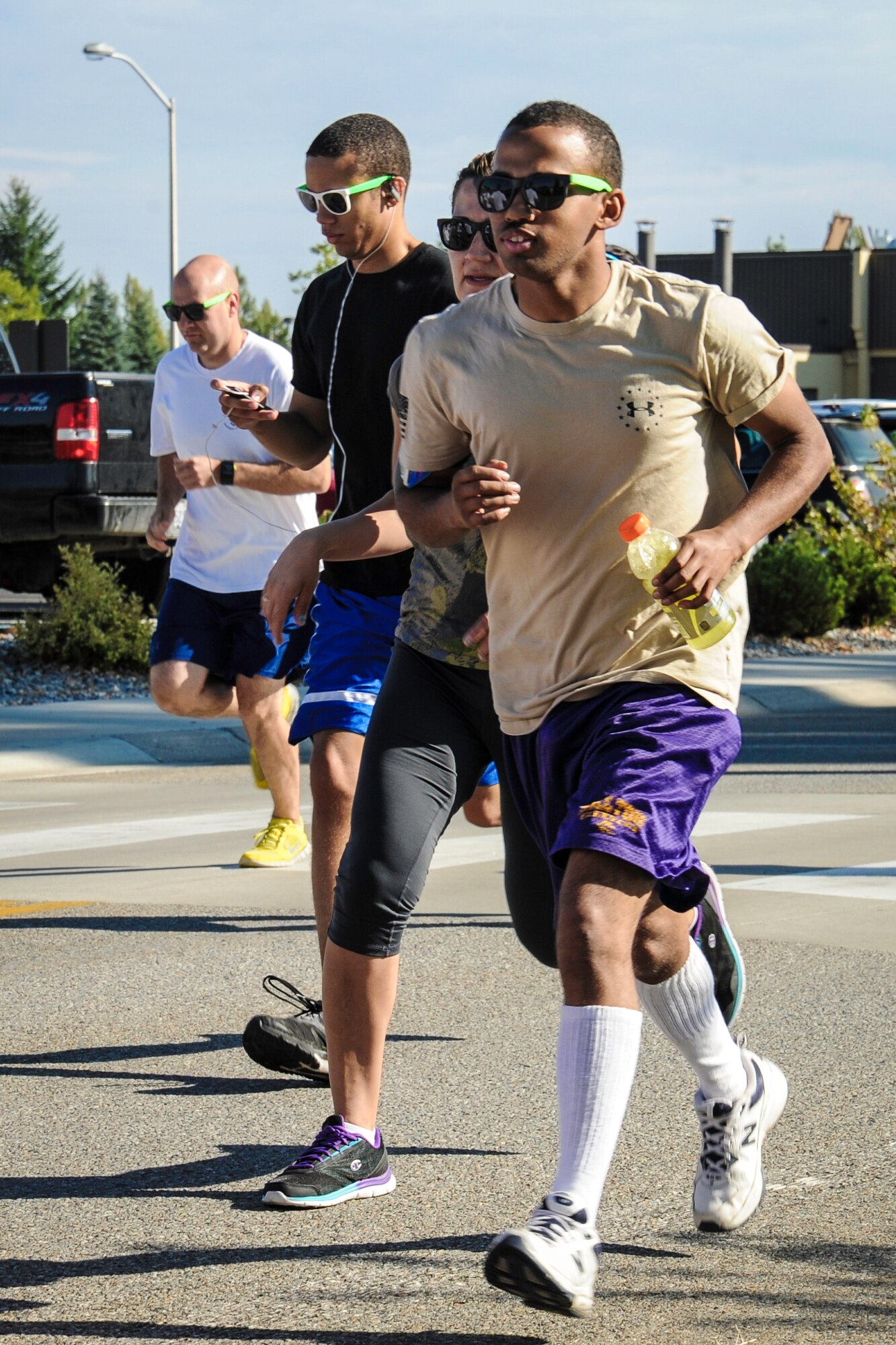 Team Fairchild Airmen and families participate in a Color Run 5k at Fairchild Air Force Base, Washington, Aug. 16, 2014. The Color Run was meant to increase base awareness for the upcoming Air Force Ball being held at the Red Lion at the Park in Spokane, Washington, on Sept. 6, celebrating the Air Force’s 67th birthday. (U.S. Air Force photo by Airman 1st Class Janelle Patiño/Released)