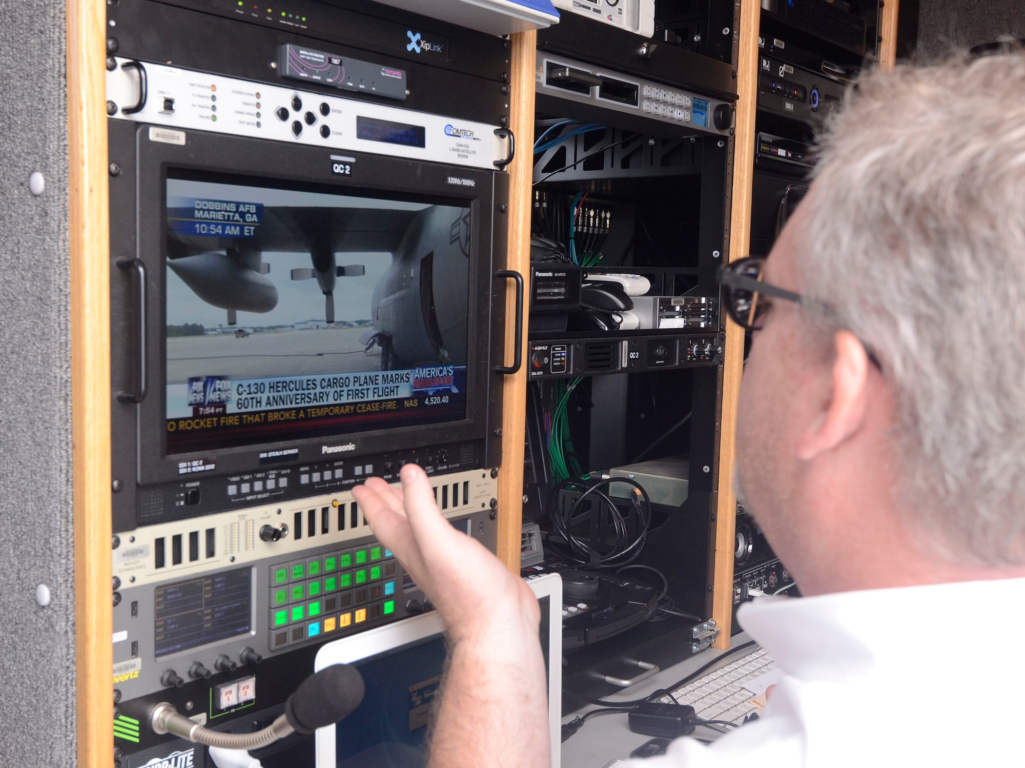 A Fox News Channel producer broadcasts live from the Dobbins Air Reserve Base airfield Aug. 19, 2014 in recognition of the 60th Anniversary of the C-130 aircraft. (U.S. Air Force photo/Don Peek)
