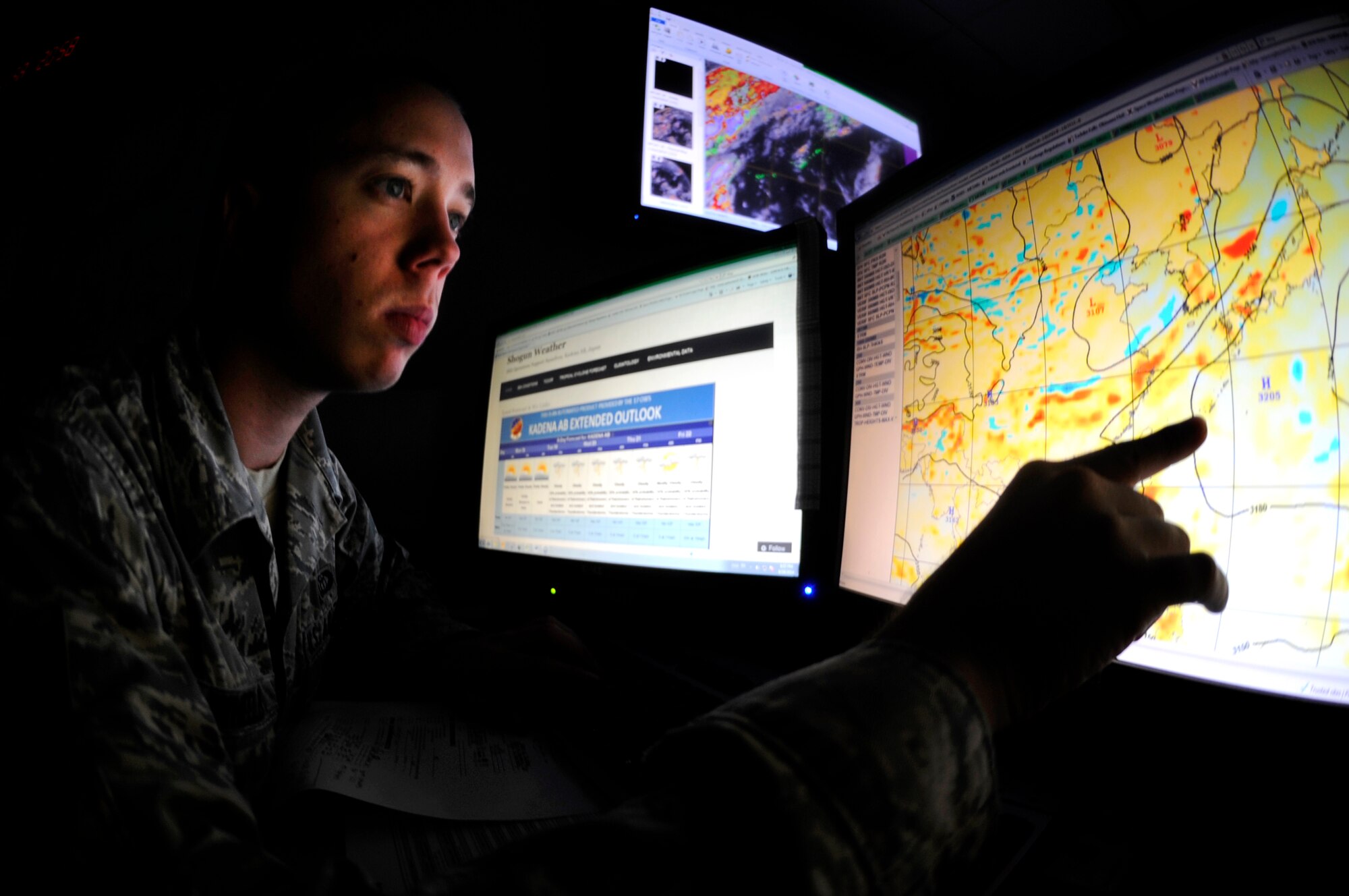 U.S. Air Force Senior Airman Corrington Wheeler, 18th Operation Support Squadron weather forecaster, analyzes meteorological parameters for thunderstorm potential for the week during a mission focused exercise on Kadena Air Base, Japan, Aug. 18, 2014. Although the base is participating in the exercise this week, several units like the weather flight continue normal operations in addition to training in a multitude of scenarios ranging from deploying forces to defending the base. (U.S. Air Force photo by Senior Airman Maeson L. Elleman)