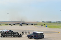 Airmen watch as a B-52H engine starts during a minimum-interval takeoff exercise on Minot Air Force Base, N.D., Aug. 15, 2014. The 5th Bomb Wing routinely conducts training operations and exercises to ensure its forces can perform their mission at any time. (U.S. Air Force photo/Senior Airman Brittany Y. Bateman)