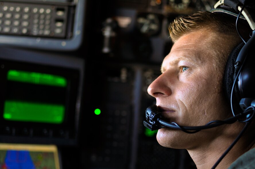 U.S. Air Force Capt. Randy D. Fasig, a C-130 navigator with the 182nd Operations Support Squadron, watches the skies above the clouds after his C-130H3 Hercules departs Operation Northern Strike in Alpena, Mich., Aug. 16, 2014. Northern Strike was a 3-week-long exercise led by the National Guard that demonstrated the combined power of joint and multinational air and ground forces. Air National Guardsmen form Peoria, Ill., and more than 5,000 other armed forces members from 12 states and two coalition nations participated in the combat training. (U.S. Air National Guard photo by Staff Sgt. Lealan Buehrer/Released)