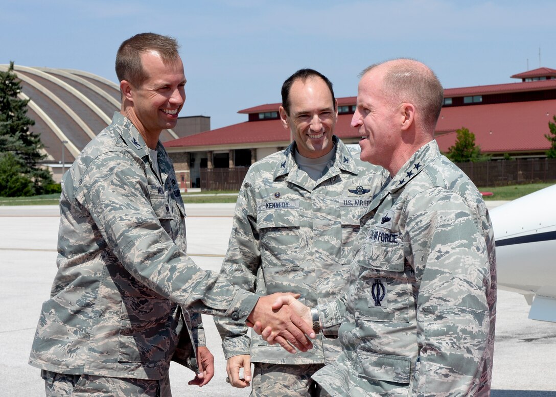 Lt. Gen. Stephen W. Wilson, Air Force Global Strike Command commander, is greeted upon arrival by Col. Kevin Kennedy, 28th Bomb Wing commander, and Col. Ty Neuman (left), 28th BW vice commander, at Ellsworth Air Force Base, S.D., Aug. 18, 2014. Wilson visited with Airmen from the 5th Bomb Wing, Minot AFB who have been operating out of Ellsworth to discuss his priorities and answer any concerns or questions Airmen may have had. (U.S. Air Force photo by Senior Airman Anania Tekurio/Released) 