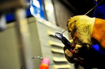 Senior Airman Matthew Vley, 5th Maintenance Squadron metals technician, prepares his equipment on Minot Air Force Base, N.D., Aug. 7, 2014. Vley is performing a task for his welding certifications. (U.S. Air Force photo/Senior Airman Brittany Y. Bateman)