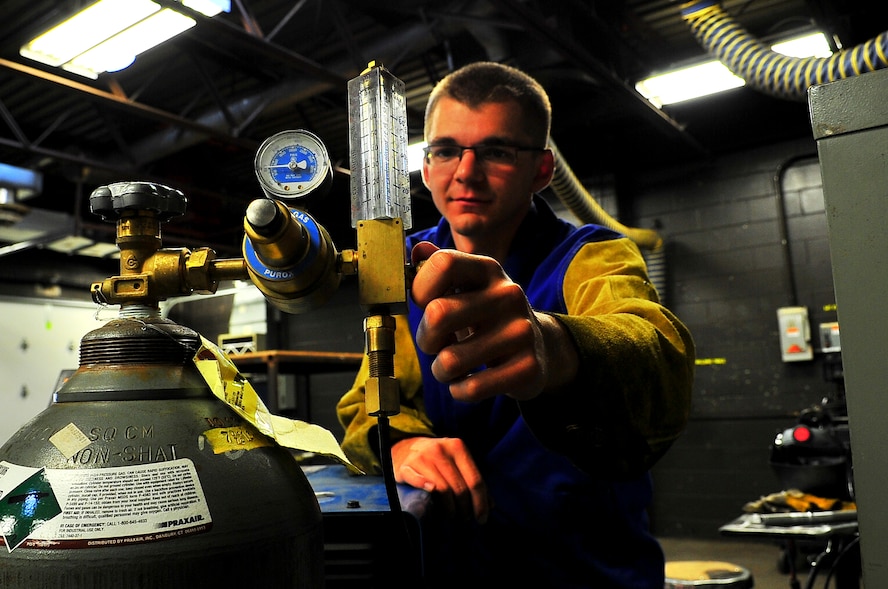 Senior Airman Matthew Vley, 5th Maintenance Squadron metals technician, prepares his equipment on Minot Air Force Base, N.D., Aug. 7, 2014. Vley is performing a task for his welding certifications. (U.S. Air Force photo/Senior Airman Brittany Y. Bateman)