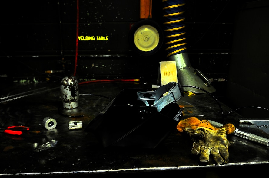 A metals technician’s gear sits on a welding table on Minot Air Force Base, N.D., Aug. 7, 2014. Metals technicians from the 5th MXS uses a lathe, drill press, torch and imagination to repair, and at times create parts that are no longer available. (U.S. Air Force photo/Senior Airman Brittany Y. Bateman)