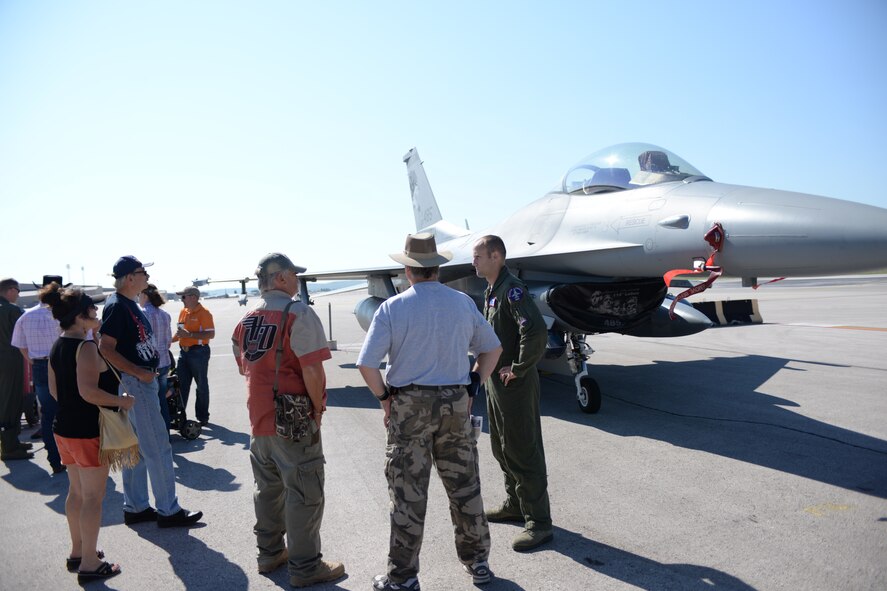 Airmen, families, and community members learn about an F-16 Fighting Falcon assigned to the 175th Fighter Squadron, South Dakota Air National Guard, on the flightline during Ellsworth’s Black Hills Community Appreciation Day at Ellsworth Air Force Base, S.D., Aug. 16, 2014. The event was designed to thank the community for their continued support and provide them with a better understanding of Ellsworth’s mission. (U.S. Air Force photo by Senior Airman Zachary Hada/Released)