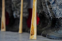 Members of the 91st Missile Wing Global Strike Challenge team stand on stage with their bully sticks during the kick-off party on Minot Air Force Base, N.D., Aug. 15, 2014. Competition categories include bomber, Intercontinental Ballistic Missile and helicopter operations, bomber and ICBM maintenance and security forces. (U.S. Air Force photo/ Senior Airman Brittany Y. Bateman)