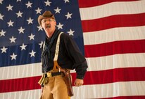 Retired Air Force Master Sgt. David Larrison, 91st Missile Wing mascot Teddy Roosevelt, chants during the 91st MW global strike challenge kick-off party on Minot Air Force Base, N.D., Aug. 15, 2014. During the party, the selected team members who are competing were introduced.  (U.S. Air Force photo/Airman 1st Class Apryl Hall)