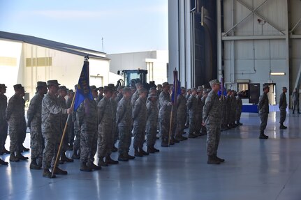 Members of the 437th Maintenance Group stand in formation during the 437th MXG Change of Command ceremony Aug. 15, 2014, at Joint Base Charleston, S.C. Col. Dennis Dabney relinquished command of the group to Col. Brian Peters, whose last position was as 436th Maintenance Operations Group deputy commander, Dover Air Force Base, Del. (U.S. Air Force photo/Senior Airman George Goslin)