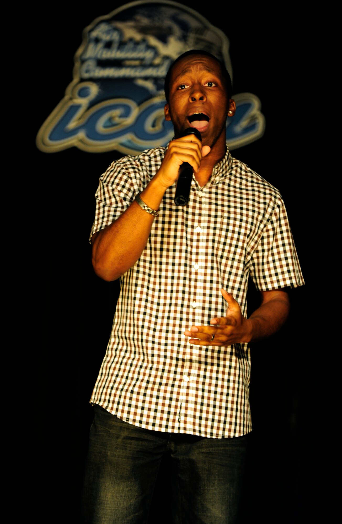 Andrew Reed won third place in this year’s base Icon competition August 15, 2014 singing, “All of Me” by John Legend.   (U.S. Air Force photo/ Staff Sgt. Stephenie Wade)