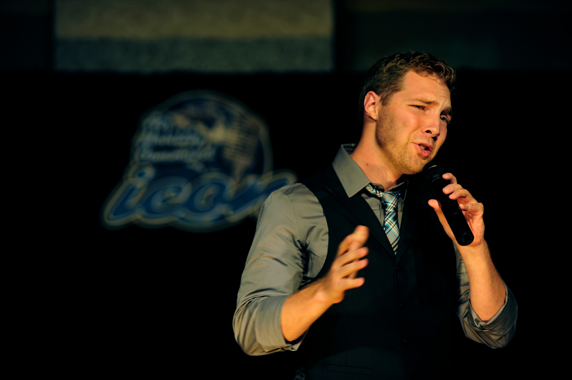 Senior Airman Tim Sentz won second place in this year’s base Icon competition August 15, 2014 singing, “Colder Weather” by Zac Brown Band. Since he was the only military member to place, he will be competing in the annual Air Mobility Command Icon finals in October. (U.S. Air Force photo/ Staff Sgt. Stephenie Wade)