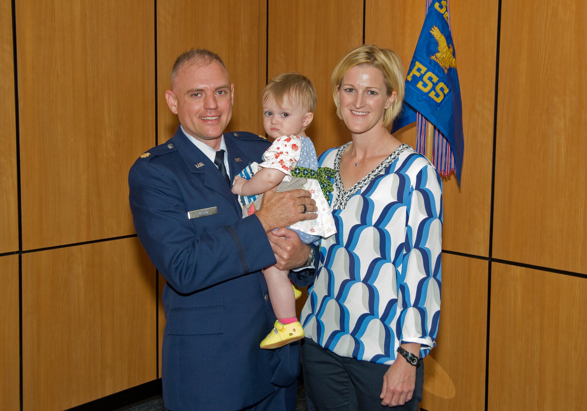 Major John Zulauf, 325th Force Support Squadron commander, and his family get their picture taken at his change of command ceremony June 6. Zulauf and his wife, Marisa, are looking forward to their time at Tyndall with their 15-month-old daughter. (U.S. Air Force photo by Airman 1st Class Alex Echols)