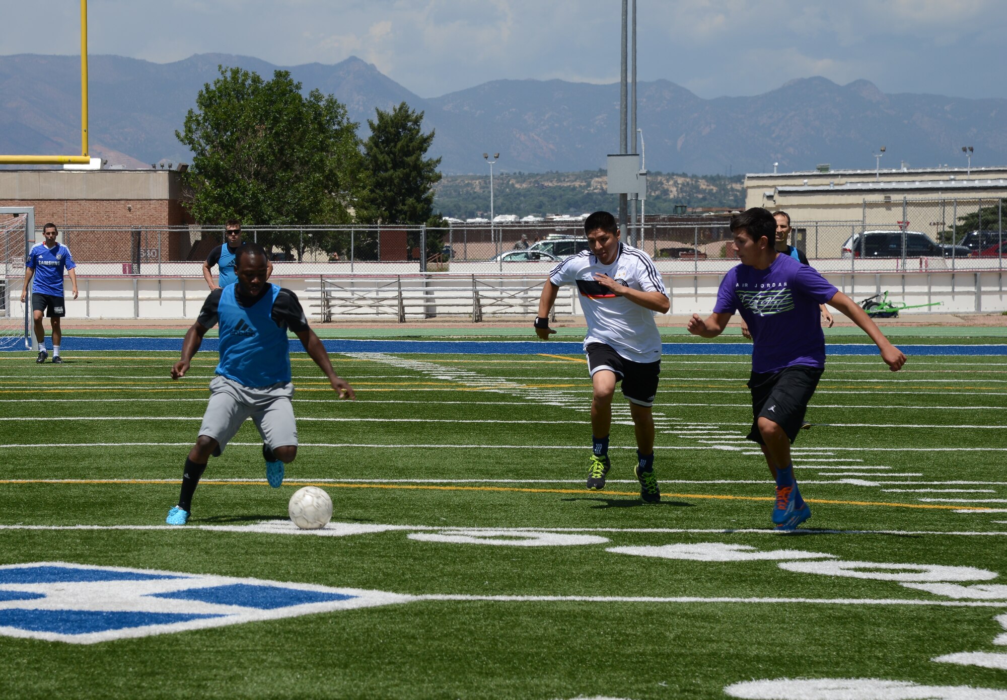 PETERSON AIR FORCE BASE, Colo. – Team Pete members tryout for the soccer team that will represent Peterson in the Tri-Wing Sports Challenge Aug. 27. Teams from Peterson will compete against teams from the 50th Space Wing at Schriever AFB and 460th Space Wing at Buckley AFB. Peterson will host the event, which includes soccer, tennis, bowling, golf and a 5K run. (U.S. Air Force photo/Tech. Sgt. Jared Marquis)