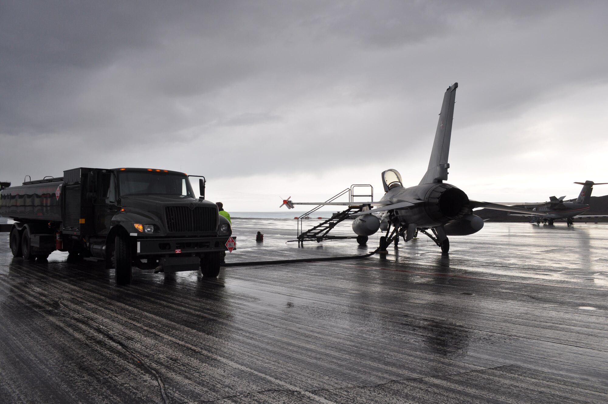 THULE AIR BASE, Greenland – A Danish F-16 gets refueled Aug. 6 at Thule Air Base. The F-16 flight was part of a capability test for search and rescue missions over Greenland, and to define logistical requirements for potential future F-16 operations. (U.S. Air Force photo/Lt. Col. Stacy Clements)