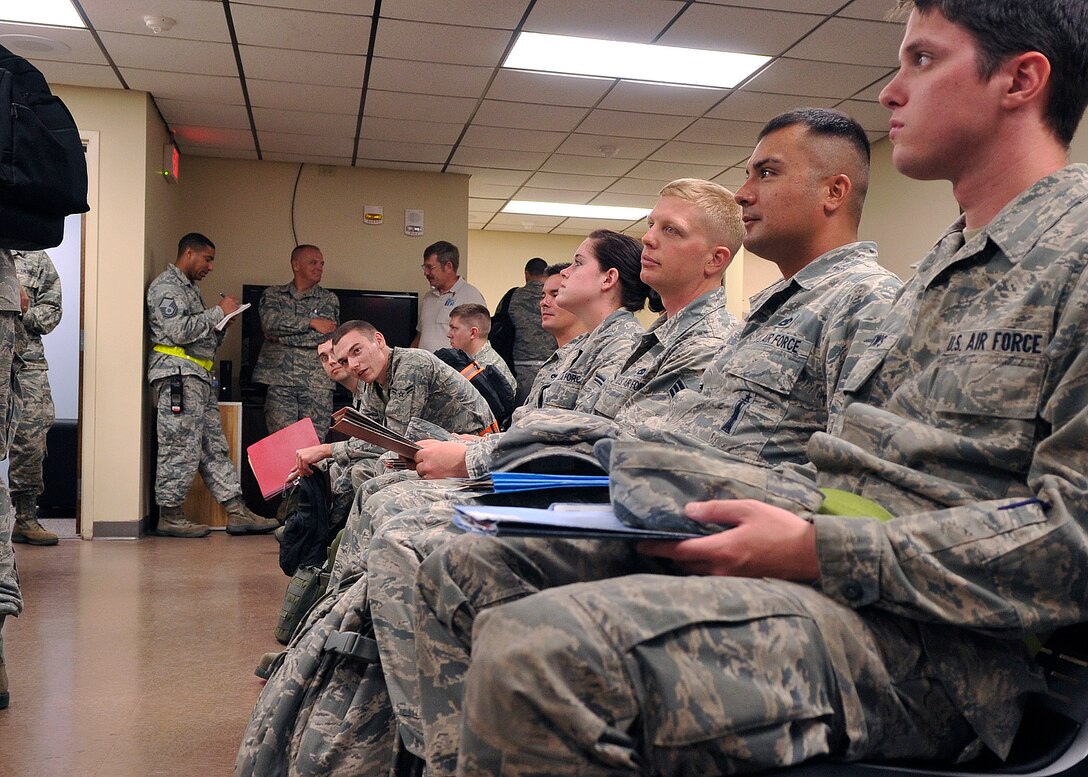 Airmen await processing through the personnel deployment function line Aug. 13. The PDF is a multi-functional entity consisting of representatives from different agencies around Team Tyndall to ensure personnel are prepared to deploy. (U.S. Air Force photo by Airman 1st Class Ty Rico Lea)