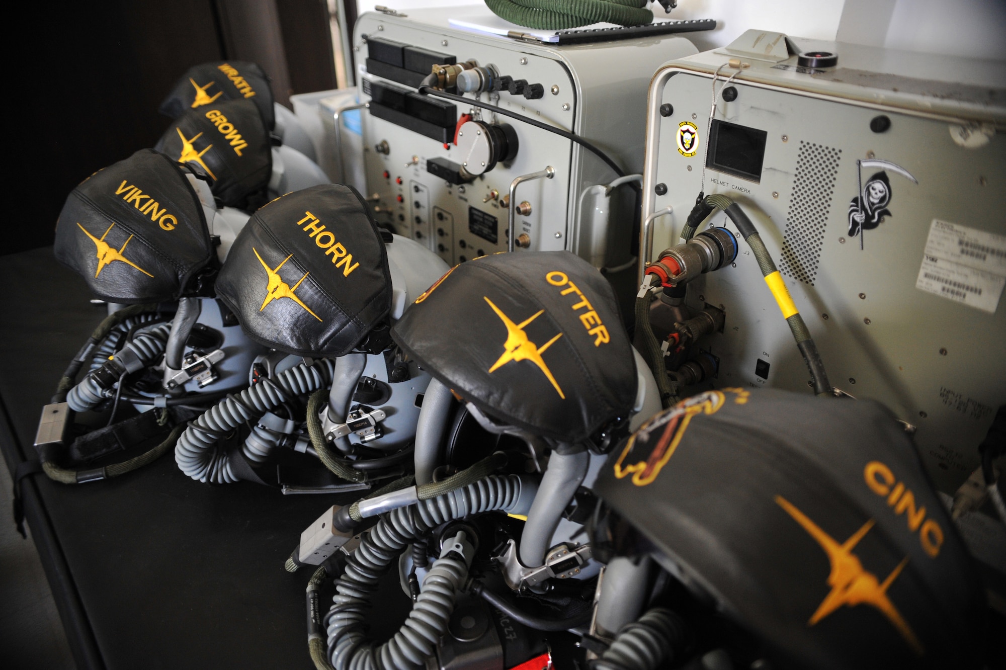Helmets sit in the aircrew flight equipment office ready to be inspected after a flight Aug. 15, 2014. From cutting the visor to fitting the oxygen mask on the helmet, it takes aircrew flight equipment Airmen roughly three hours to fit a pilot with a brand new helmet to ensure everything works properly. (U.S. Air Force photo/Senior Airman Hailey Haux)