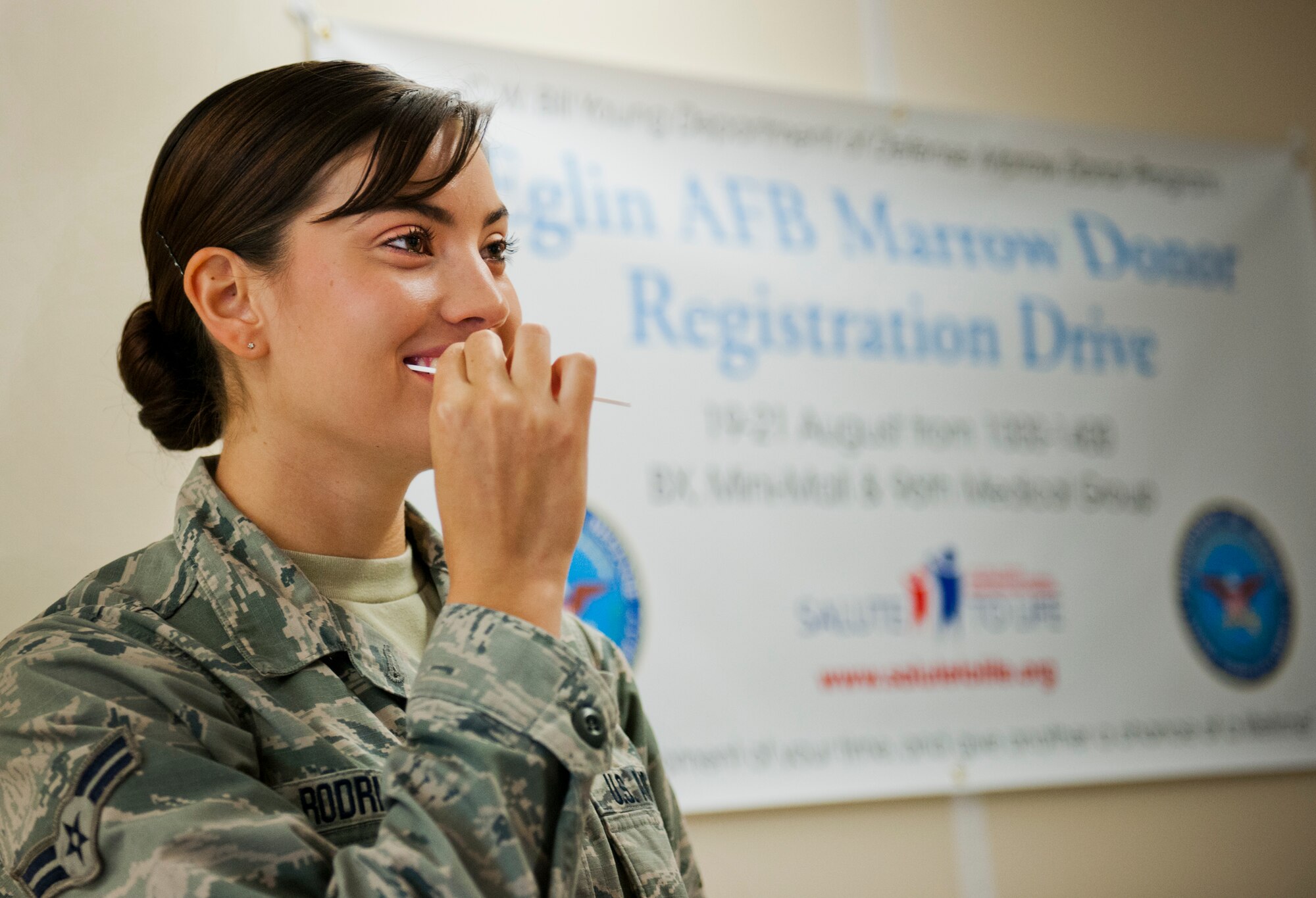 Airman 1st Class Lauren Rodriguez, 96th Medical Support Squadron, swabs her cheek as part of her bone marrow donor registration during a drive Aug. 19 at Eglin Air Force Base, Fla.  The Department of Defense sponsored donor registration drive is currently underway at Eglin’s hospital and Base Exchange as well as locations on Hurlburt Field.  The drive continues through Aug. 21.  (U.S. Air Force photo/Samuel King Jr.)