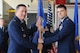 GOODFELLOW AIR FORCE BASE, Texas -- Col. Dominic J. Bernardi III, 17th Mission Support Group Commander, passes the 17th Civil Engineer Squadron guidon to Maj. David A. Sulhoff, during a change of command ceremony at the fire station Aug. 14. Sulhoff assumed command of the 17th CES from Lt. Col. Kurt E. Muller. (U.S. Air Force photo/ Staff Sgt. Laura R. McFarlane)