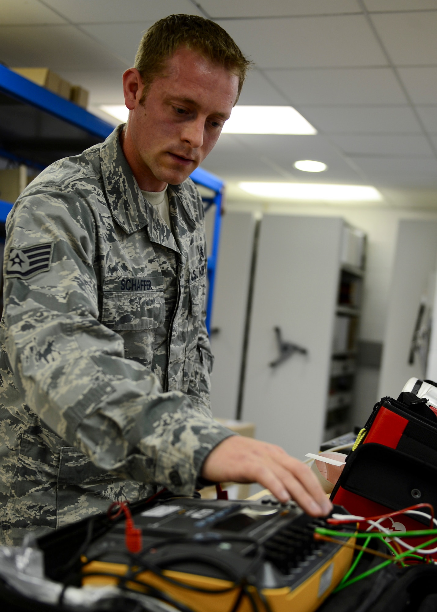 Staff Sgt. Ryan Schaffer, 48th Medical Support Squadron biomedical equipment maintenance technician, performs preventive maintenance at Royal Air Force Lakenheath, England, June 17, 2014. Airmen of the 48th MDSS conduct maintenance and inspections at RAF Lakenheath as well as at six different clinics throughout the U.K. and Norway. (U.S. Air Force photo by Airman 1st Class Dawn M. Weber/Released)
