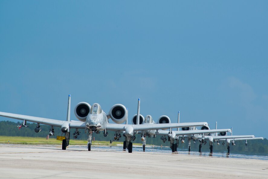 Four U.S. Air Force A-10C Thunderbolt II aircraft make their way down a runway at Moody Air Force Base, Ga., Aug. 18, 2014. Moody’s A-10s are flown out of the 23d Fighter Group which traces its history back to the 23d Pursuit Group, a unit that was constituted 10 days after the Japanese attack on Pearl Harbor in 1941. (U.S. Air Force photo by Staff Sgt. Jamal D. Sutter/Released)