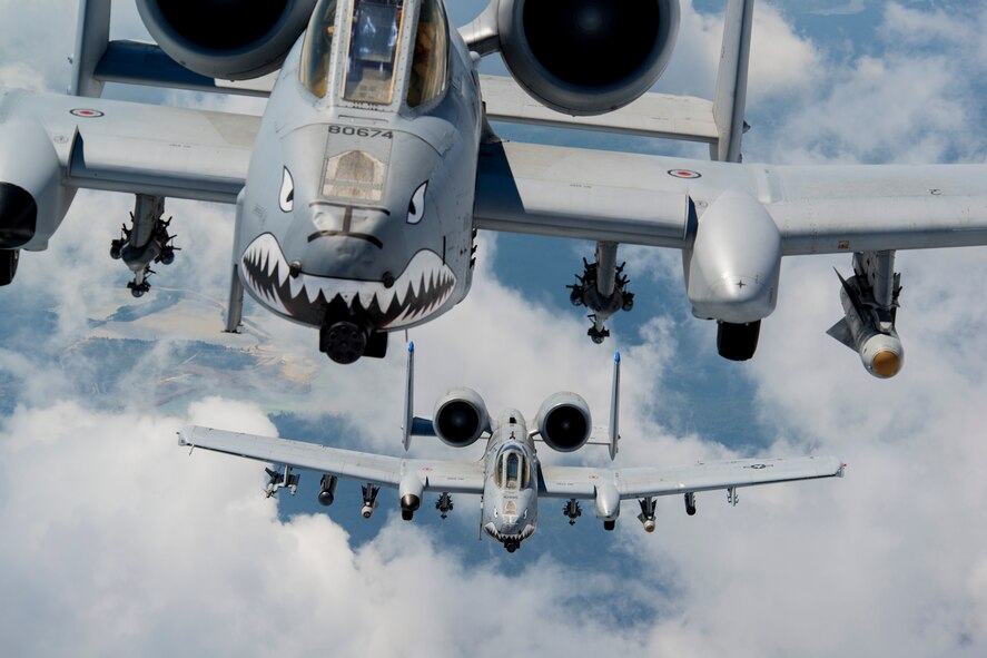 U.S. Air Force Capts. Andrew Glowa, lead, and William Piepenbring, both with the 74th Fighter Squadron out of Moody Air Force Base, Ga., fly two A-10C Thunderbolt II over the skies of southern Georgia, Aug. 18, 2014. The 74th FS is one of two active-duty, combat-ready squadrons at Moody that performs close air support missions with the A-10. (U.S. Air Force photo by Staff Sgt. Jamal D. Sutter/Released)