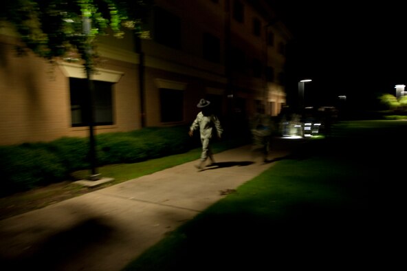 Military training instructors bring Basic Officer Training, Commissioned Officer Training and Academy of Medical Science cadets and officers back to the blue line ceremony July 19, 2014, at Maxwell Air Force Base.This is the first time that all three service components have crossed the blue line together. The blue line ceremony signifies the new Airmen’s commitment to the Air Force and represents crossing from the civilian world into the military world. (U.S. Air Force photo by Staff Sgt. Natasha Stannard)