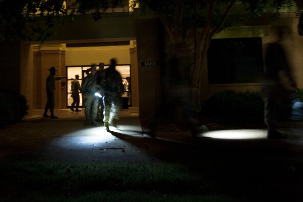 Military training instructors bring Basic Officer Training, Commissioned Officer Training and Academy of Medical Science cadets and officers back to the blue line ceremony July 19, 2014, at Maxwell Air Force Base. This is the first time that all three service components have crossed the blue line together. Approximately 346 officers and officer candidates crossed the line represents their new commitment to the military. (U.S. Air Force photo by Staff Sgt. Natasha Stannard)