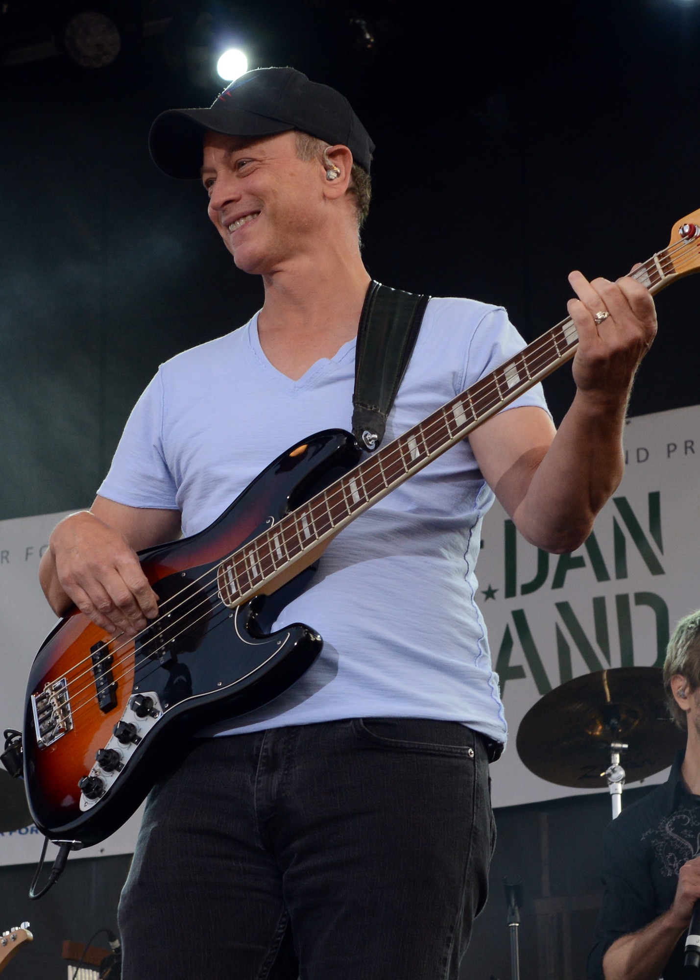 Gary Sinise of the Lt. Dan Band strums a base guitar during a free concert Aug. 15 at Malmstrom Air Force Base, Mont. The Lt. Dan Band, a cover band named after a wounded soldier Sinise portrayed in the film “Forrest Gump,” and has been entertaining and visiting U.S. service members all over the world for more than a decade. (U.S. Air Force photo/Senior Airman Katrina Heikkinen)