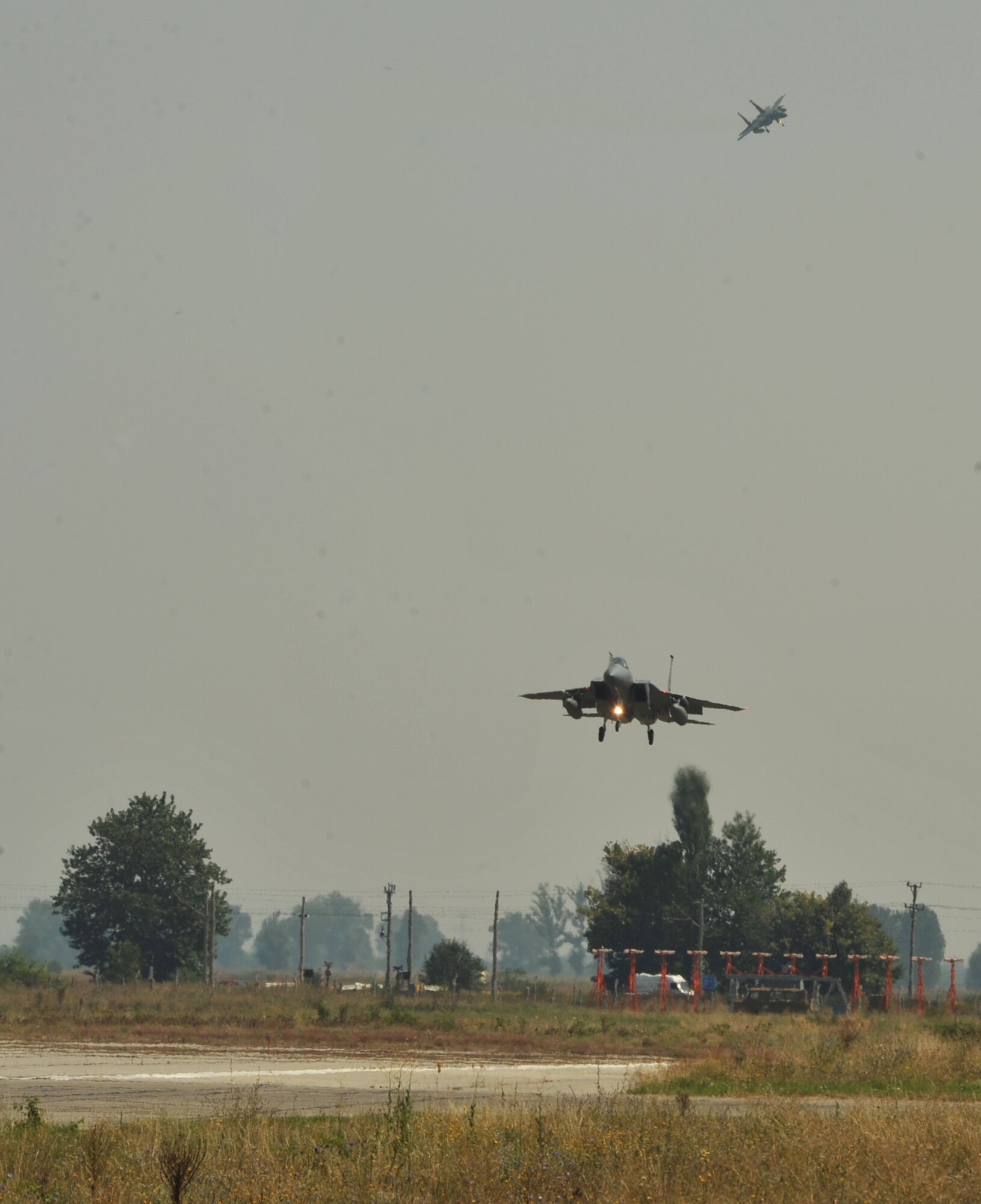 F-15s from Royal Air Force Lakenheath, England fly into Graf Ignatievo Air Base, Bulgaria to participate in a bilateral training event, Thracian Eagle 2014, Aug. 18 through Sep. 1. Pilots, maintainers and a mixture of other professions from RAF Lakenheath, including Airmen from Ramstein Air Base, Germany will enhance interoperability with Bulgaria and maintain joint readiness. (U.S. Air Force photo/Senior Airman Hailey Haux)