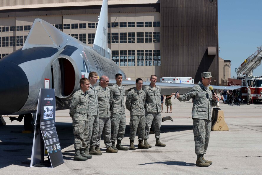 Col. Kevin Kennedy (right), 28th Bomb Wing commander, unveils the F-102 Delta Dagger during Ellsworth’s Black Hills Community Appreciation Day, Aug. 16, 2014. The F-102 Delta Dagger is a historic fighter aircraft and the newest addition to the South Dakota Air and Space Museum aircraft displays. (U.S. Air Force Photo by Airman 1st Class Rebecca Imwalle/ Released)