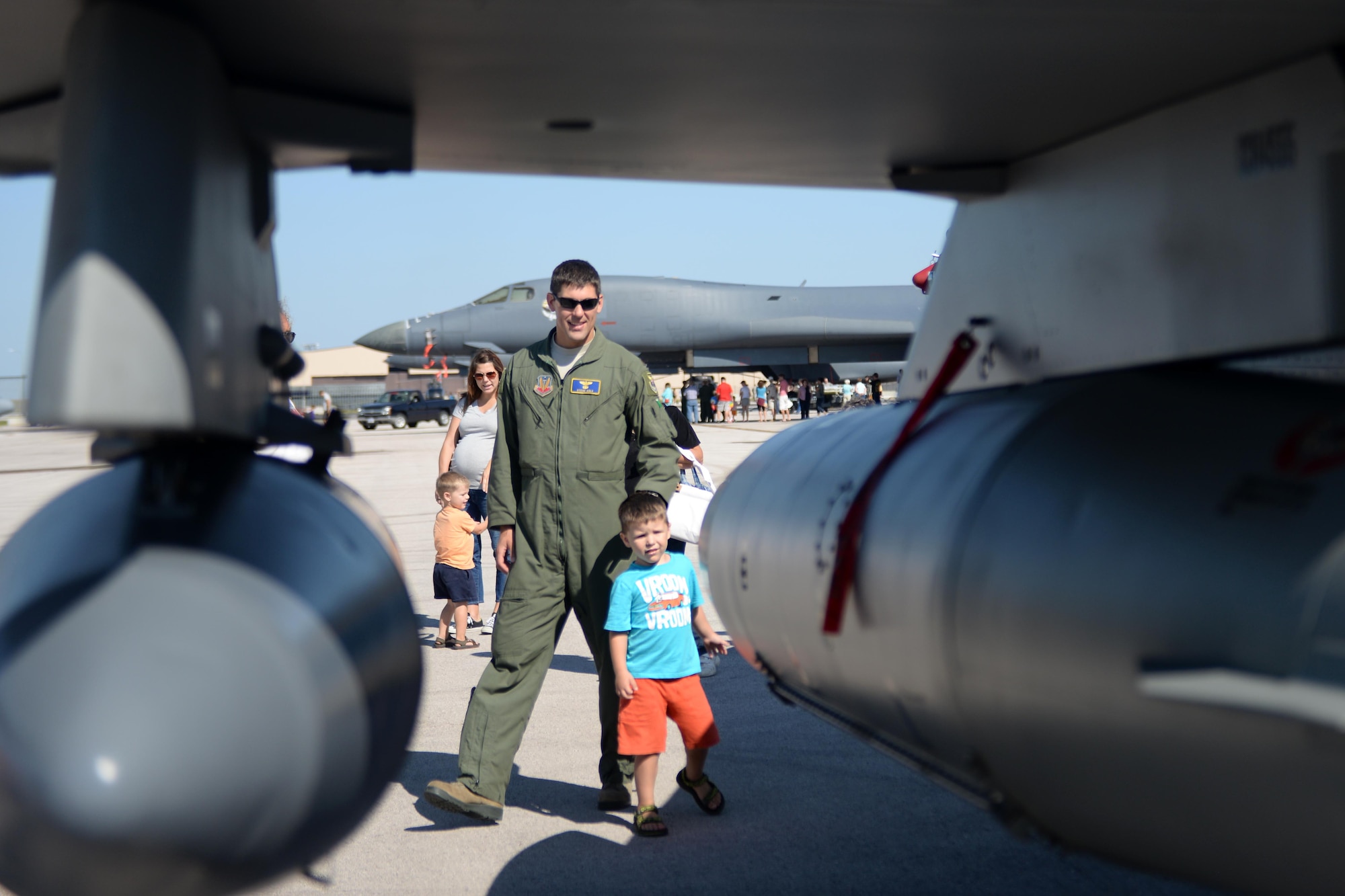 Maj. Steve Koly, 28th Bomb Wing executive officer, looks at an F-16 Fighting Falcon with his son, Jack, during Ellsworth’s Black Hills Community Appreciation Day, Aug. 16, 2014. The event featured take-offs, high-speed flybys and multiple aircraft static displays for all attendees to experience at the base. (U.S. Air Force Photo by Airman 1st Class Rebecca Imwalle/ Released)