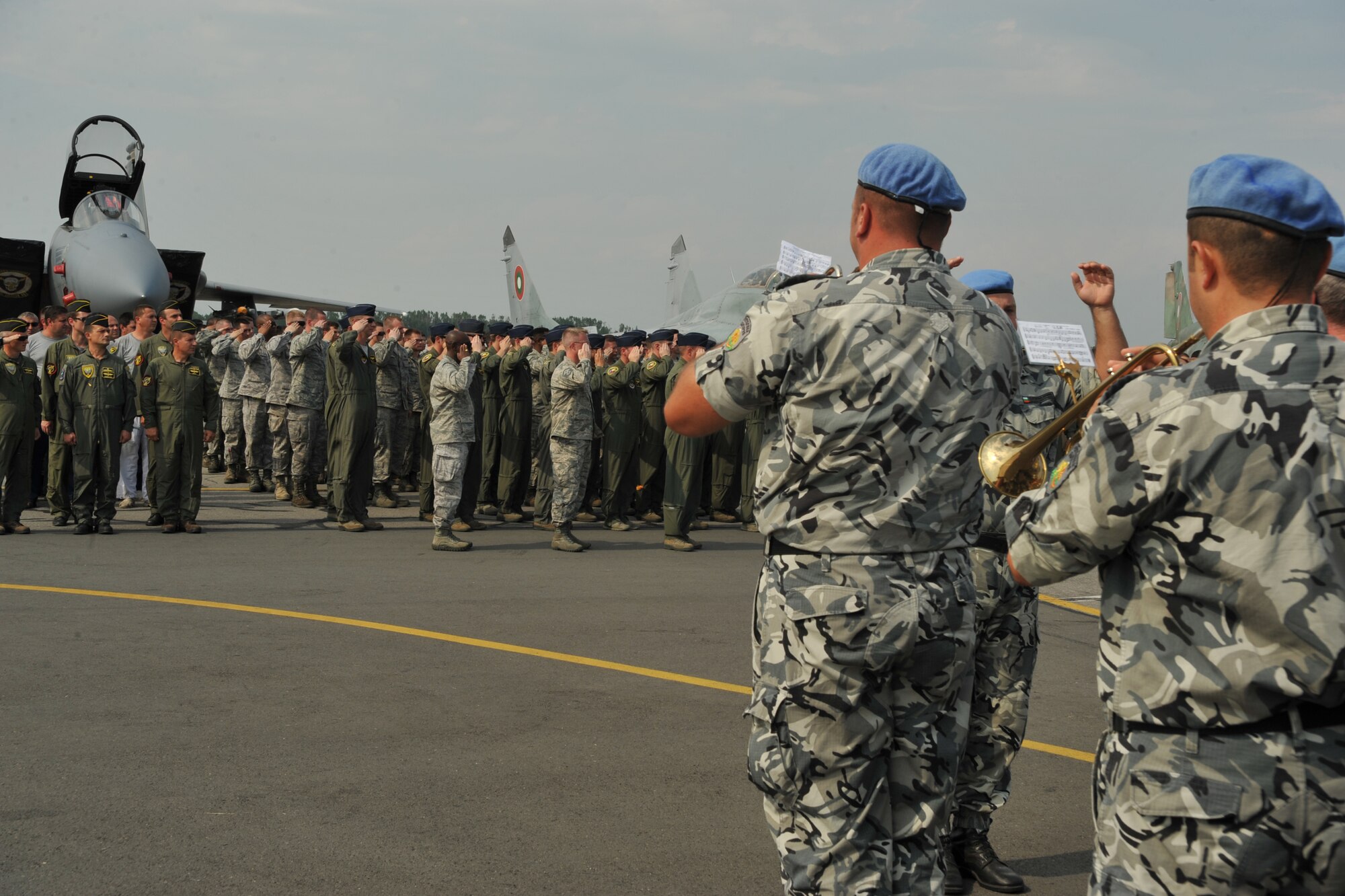 Members from the Bulgarian Air Force band play the Bulgarian and American National Anthems during an opening ceremony at Graf Ignatievo Air Base, Bulgaria, August 15, 2014. More than 180 Airmen from U.S. Air Forces in Europe and Air Forces Africa flew down to Graf Ignatievo Air Base near Plovdiv Bulgaria to participate in a bilateral training event, Thracian Eagle 2014, Aug. 18 through Sep. 1. (U.S. Air Force photo/Senior Airman Hailey Haux)