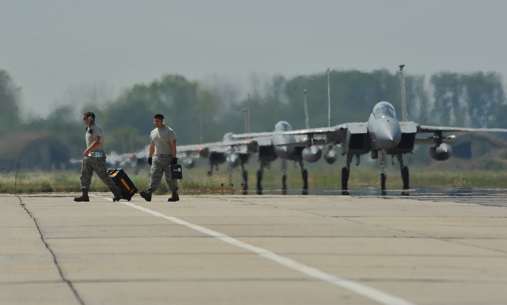 Airmen from Royal Air Force Lakenheath, England, prepare to assist with post-flight checks at Graf Ignatievo Air Base near Plovdiv Bulgaria, August 15, 2014. More than 180 Airmen from U.S. Air Forces in Europe and Air Forces Africa flew down to Graf Ignatievo Air Base near Plovdiv Bulgaria to participate in a bilateral training event, Thracian Eagle 2014, Aug. 18 through Sep. 1. (U.S. Air Force photo/Senior Airman Hailey Haux)