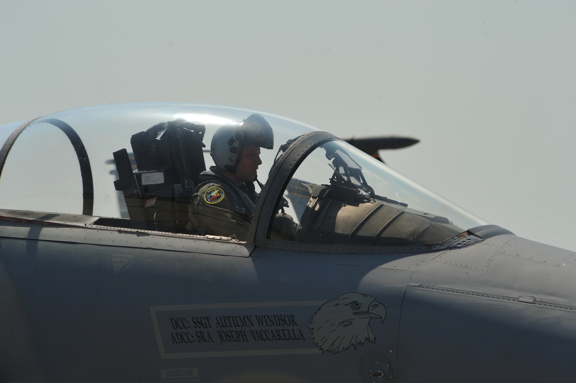 A pilot from the 493rd Fighter Squadron, Royal Air Force Lakenheath, England, gather his belongings to exit his jet at Graf Ignatievo Air Base, Bulgaria August 15, 2014. More than 180 Airmen from U.S. Air Forces in Europe and Air Forces Africa flew down to Graf Ignatievo Air Base near Plovdiv Bulgaria to participate in a bilateral training event, Thracian Eagle 2014, Aug. 18 through Sep. 1. (U.S. Air Force photo/Senior Airman Hailey Haux)