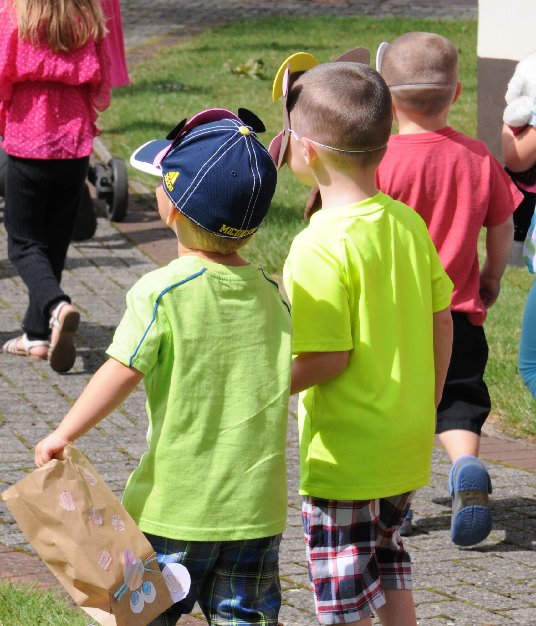 Team Mildenhall children take part in a “Paws to Read” pet parade and costume contest Aug. 13, 2014, at the library on RAF Mildenhall, England. This was the final event for the 2014’s summer reading program and the organizers encouraged participants to wear a costume if they wished. (U.S. Air Force photo/Gina Randall/Released)
