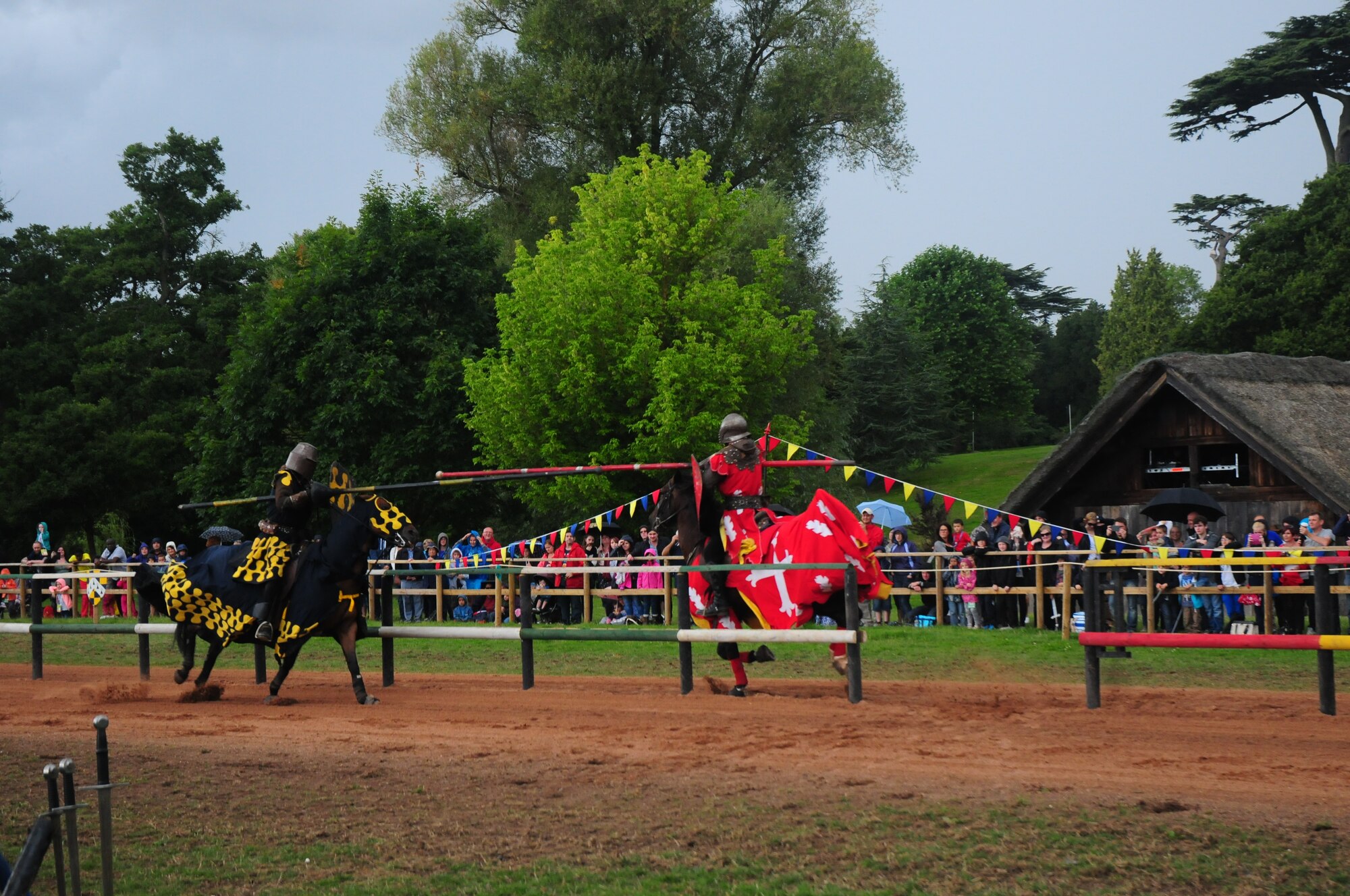 Deployed Airmen’s families from Royal Air Force Lakenheath, England, gather to watch a mock jousting tournament during a 48th Fighter Wing Chaplain Corps resiliency trip to Warwick Castle, Aug. 14, 2014. Eighty-four family members, representing a variety of 48th FW personnel, took advantage of the opportunity to get off base and explore the local community.   (U.S. Air Force Photo by Airman 1st Class Amanda Sampson/Released)