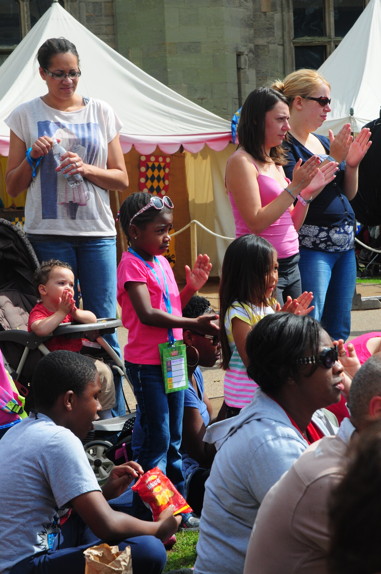Deployed Airmen’s families from Royal Air Force Lakenheath, England, watch a medieval fighting demonstration during a 48th Fighter Wing Chaplain Corps resiliency trip to Warwick Castle, Aug. 14, 2014. Families met others that were experiencing similar circumstances while also experiencing British culture and heritage. (U.S. Air Force Photo by Airman 1st Class Amanda Sampson/Released)
