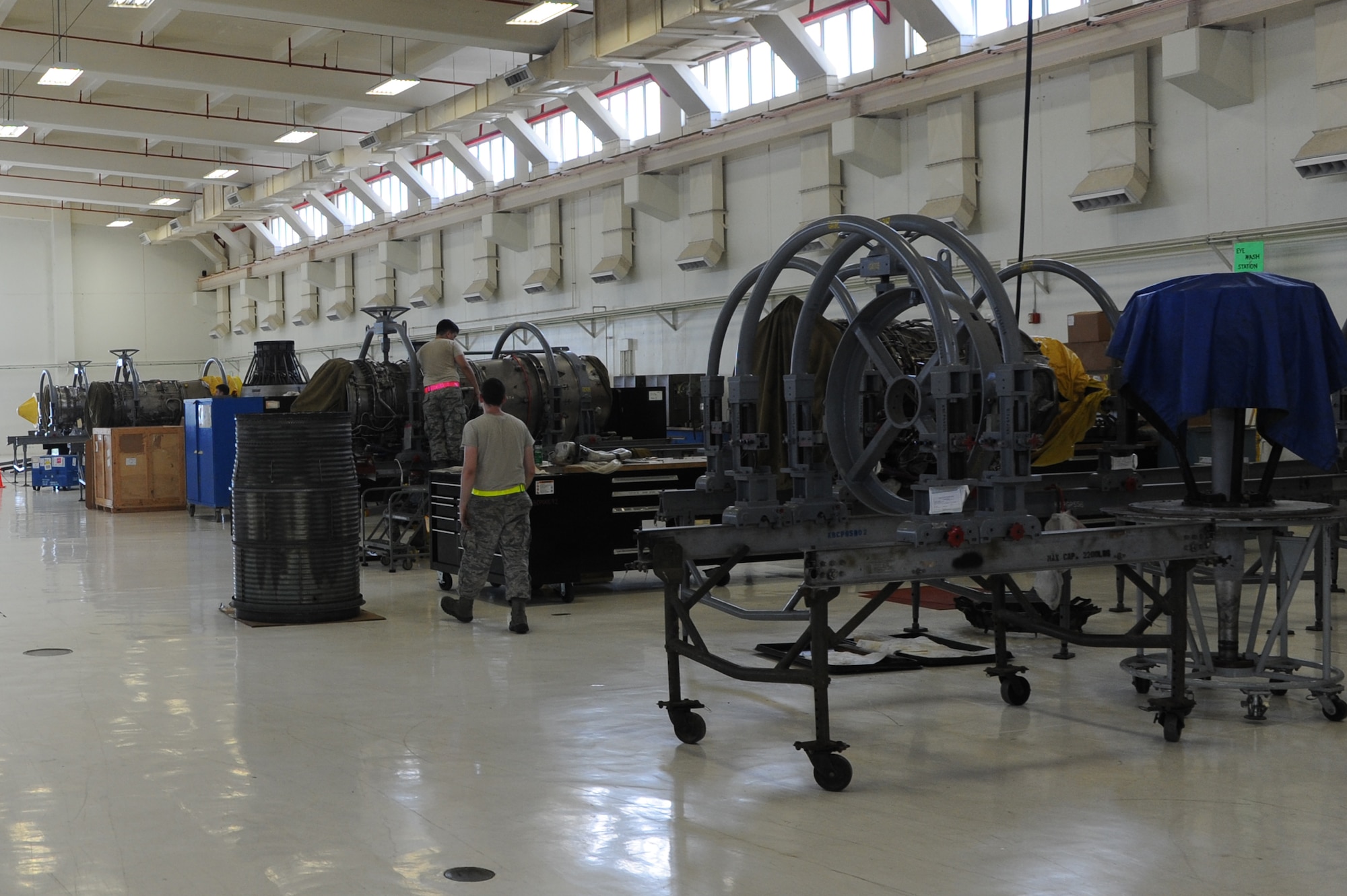 A row of F-100 engines sits in the 18th Component Maintenance Squadron back shop wating to be taken apart, inspected, and repaired to be placed onto F-15 Eagle fighter jets on Kadena Air Base, Japan, Aug.19, 2014. The 18th CMS provides maintenance on electronics for propulsion, avionics and airframe accessory sub-systems for all assigned aircraft on Kadena and also for the A-10 Warthog assigned to Osan Air Base, Korea. (U.S. Air Force photo by Airmen 1st Class Stephen G. Eigel/Released) 