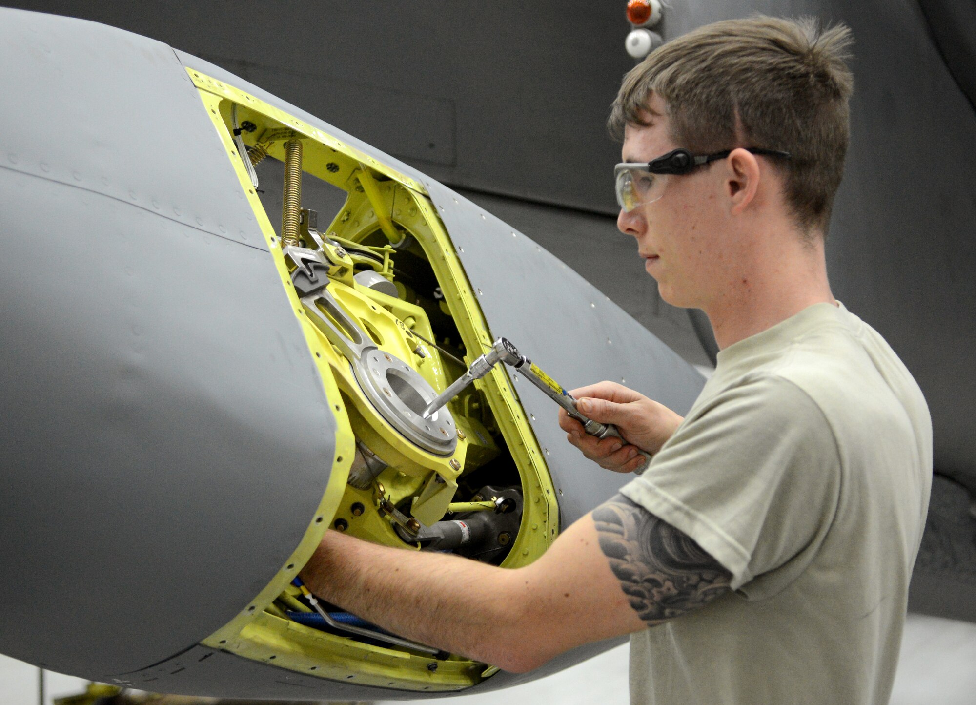 U.S. Air Force Senior Airman Trevor Tesmer, 100th Maintenance Squadron aircraft hydraulics systems journeyman from Howell, Mich., works on the boom of a KC-135 Stratotanker during an isochronal inspection Aug. 14, 2014 on RAF Mildenhall, England. During the inspection, which occurs at set intervals for each plane, it was found that the boom attached to the plane was failing, so it was completely replaced. (U.S. Air Force photo/Airman 1st Class Dillon Johnston/Released)