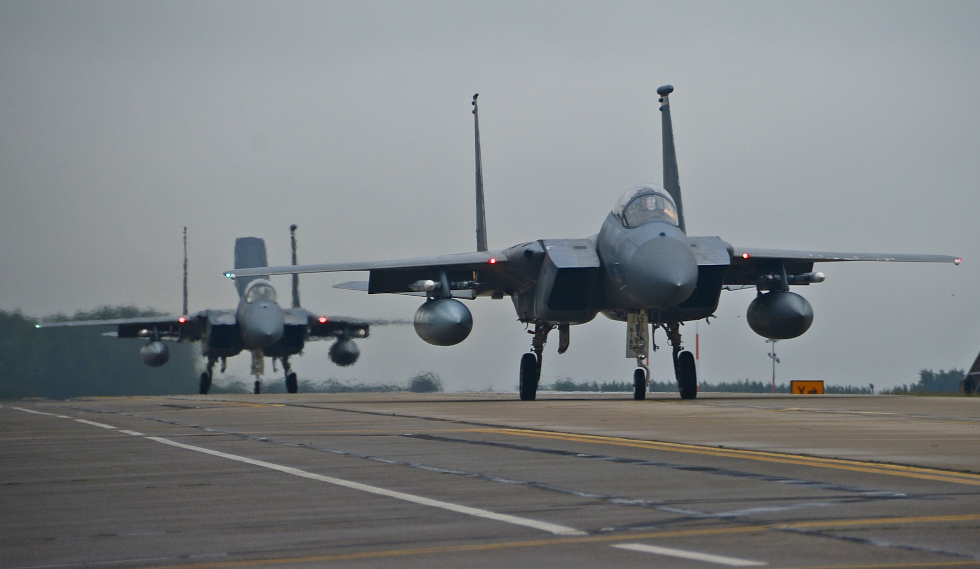 F-15 Eagle fighter jets assigned to the 48th Fighter Wing taxi the runway Aug. 15, 2014, before take off at Royal Air Force Lakenheath, England, in preparation for a bilateral training event at Graf Ignatievo Air Base, Bulgaria. The F-15 fighter pilots’ flying training deployment to Bulgaria focuses on maintaining joint readiness while building interoperability capabilities. (U.S. Air Force photo by Airman 1st Class Erin O’Shea/Released)