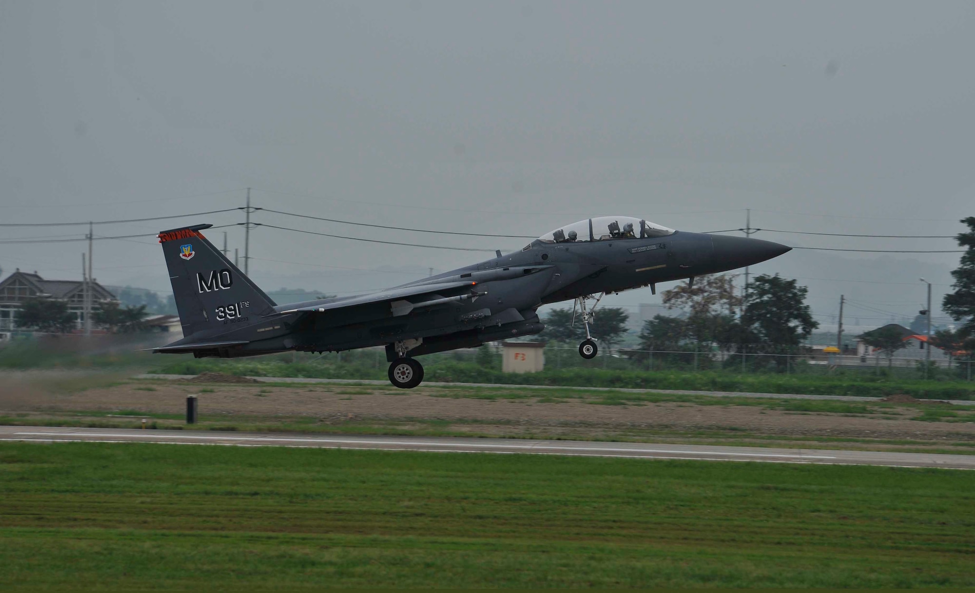An F-15 Strike Eagle from the 391st Fighter Squadron, Mountain Home Air Force Base, Idaho, takes off to complete a sortie on Osan Air Base, Republic of Korea, Aug. 15, 2014. There 391st FS sent 12 F-15s to Osan for a temporary duty assignment as part of a theater support package. (U.S. Air Force photo/Senior Airman David Owsianka)