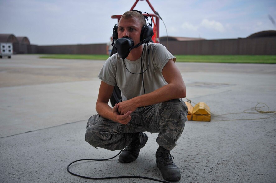 Airman 1st Class Tyler Bertapelle, 391st Aircraft Maintenance Unit crew chief, Mountain Home Air Force Base, Idaho, checks for leaks on an F-15 Strike Eagle during a pre-flight inspection on Osan Air Base, Republic of Korea, Aug. 15, 2014. The unit prepares and maintains the F-15 Eagle to ensure mission success. (U.S. Air Force photo/Senior Airman David Owsianka)