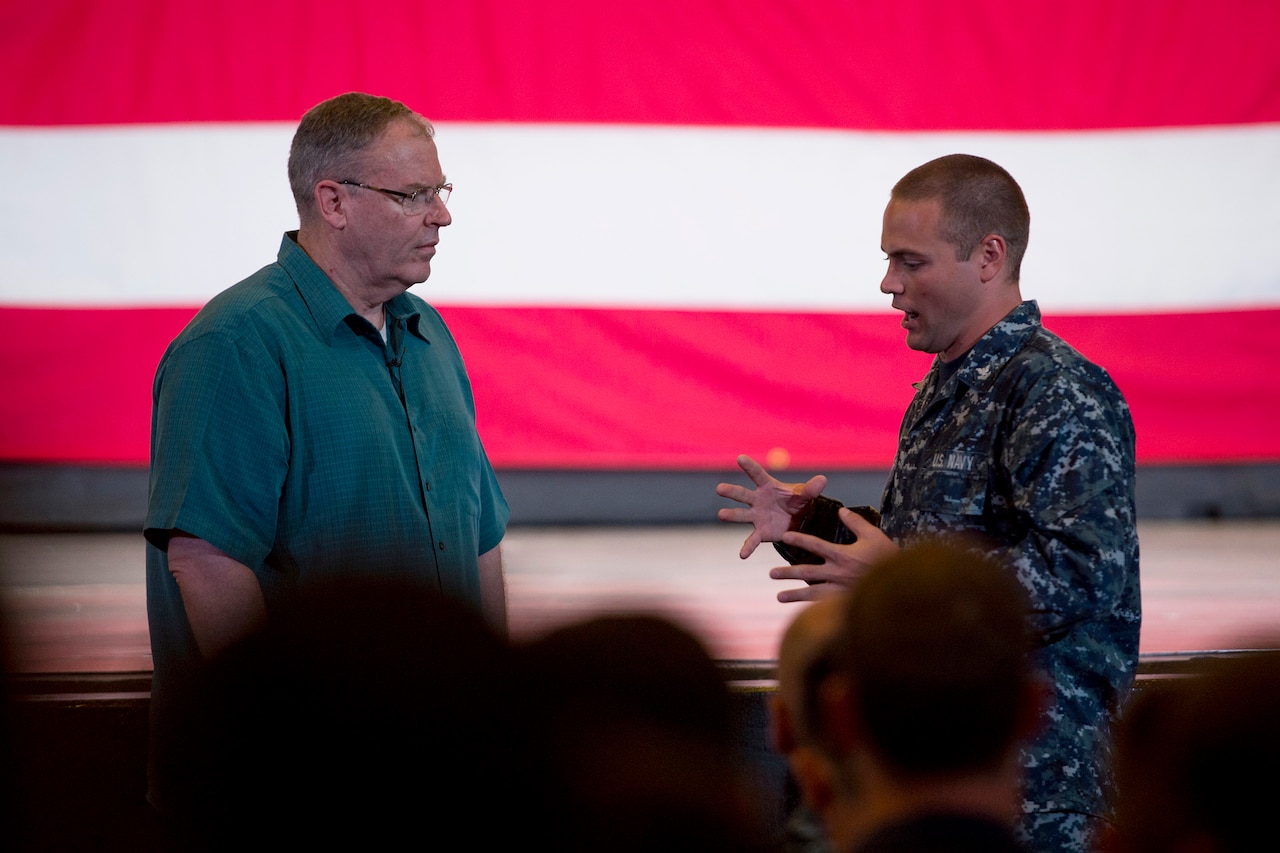 Deputy Defense Secretary Bob Work, left, during a question-and-answer session on Naval Base Guam, Aug. 19, 2014.  DoD photo by U.S. Air Force Master Sgt. Adrian Cadiz 
