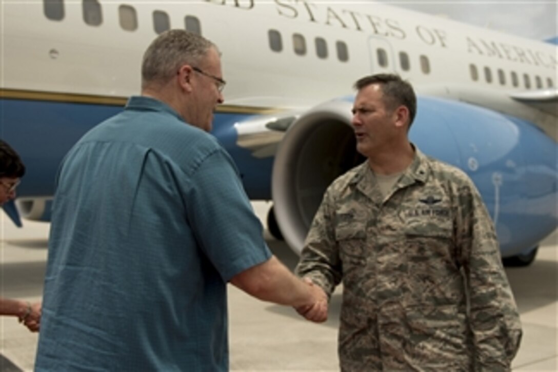 Deputy Defense Secretary Bob Work, left, speaks with Air Force Brig. Gen. Andrew J. Toth, right, commander of the 36th Wing, as he arrives on Andersen Air Force Base, Guam, Aug. 19, 2014. 